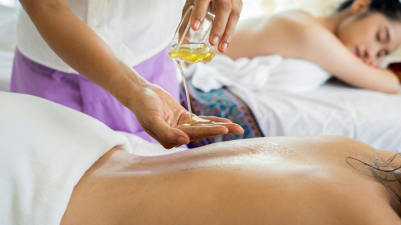 Two women relaxing on spa table waiting to get an oil massage.