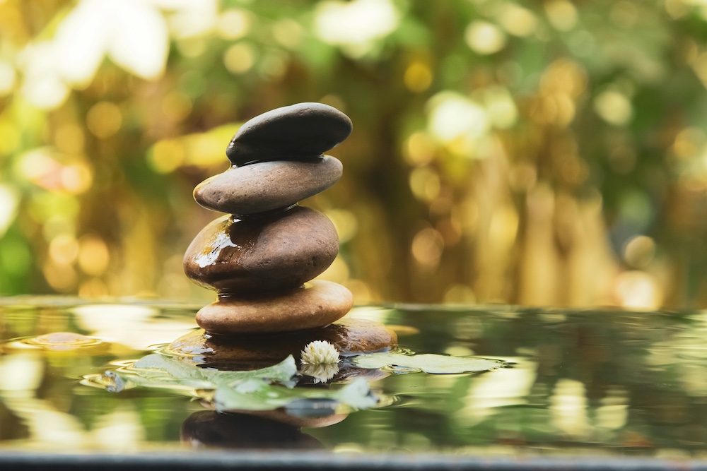 Stones stacked in water.