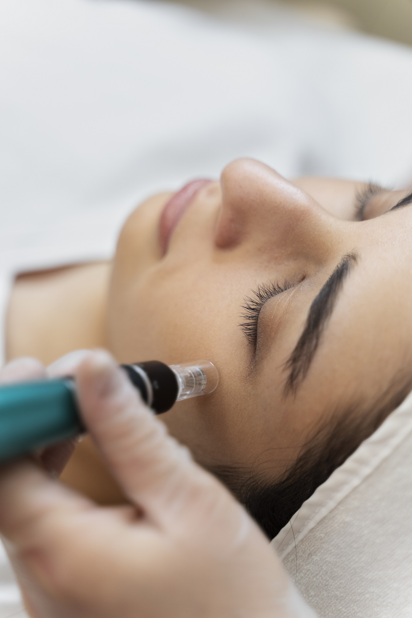 Woman receiving facial treatment.